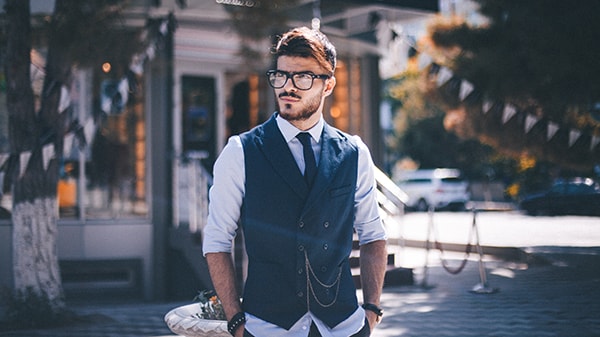 A man wearing a suit and glasses